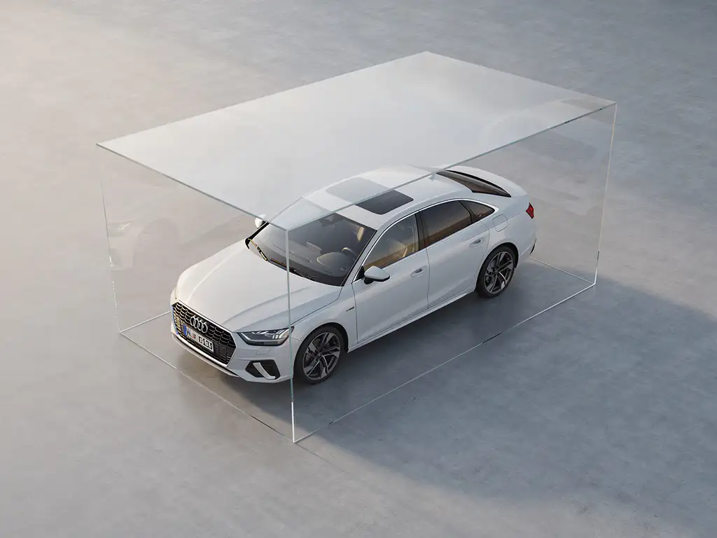 Witte huurauto geparkeerd op betonnen vloer met transparant beschermschild erboven in minimalistische setting